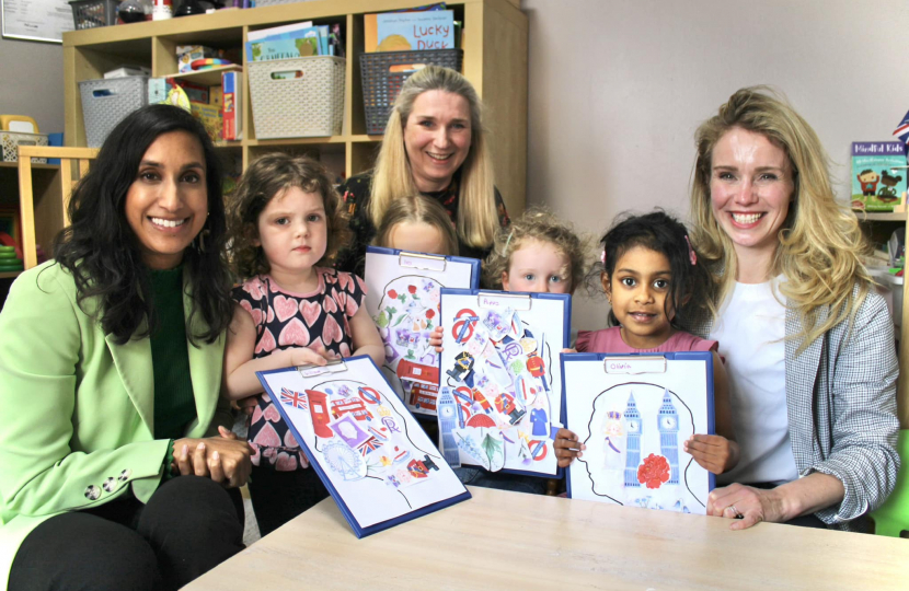 Claire with children at a nursery.