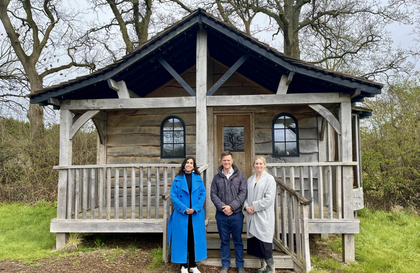 Claire with Charlie and Rebecca outside one of their lodges.