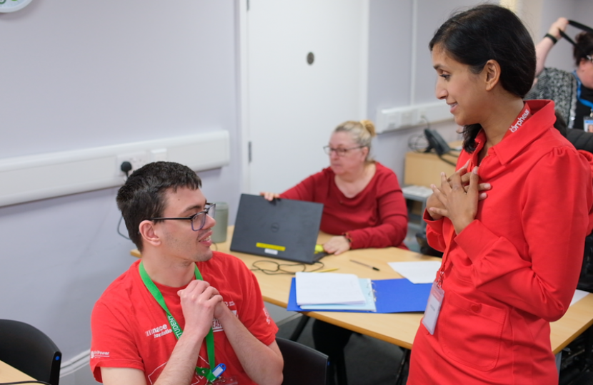 Claire chatting to a student in an Orpheus classroom