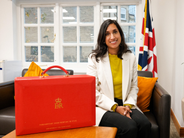 Claire in her Ministerial office, sat next to her red box.