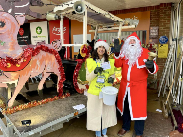 Claire collecting money for the appeal with Father Christmas