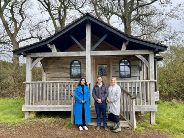 Claire with Charlie and Rebecca outside one of their lodges.