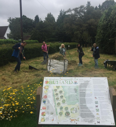 Claire with Anne Richardson and team in the orchard community garden 